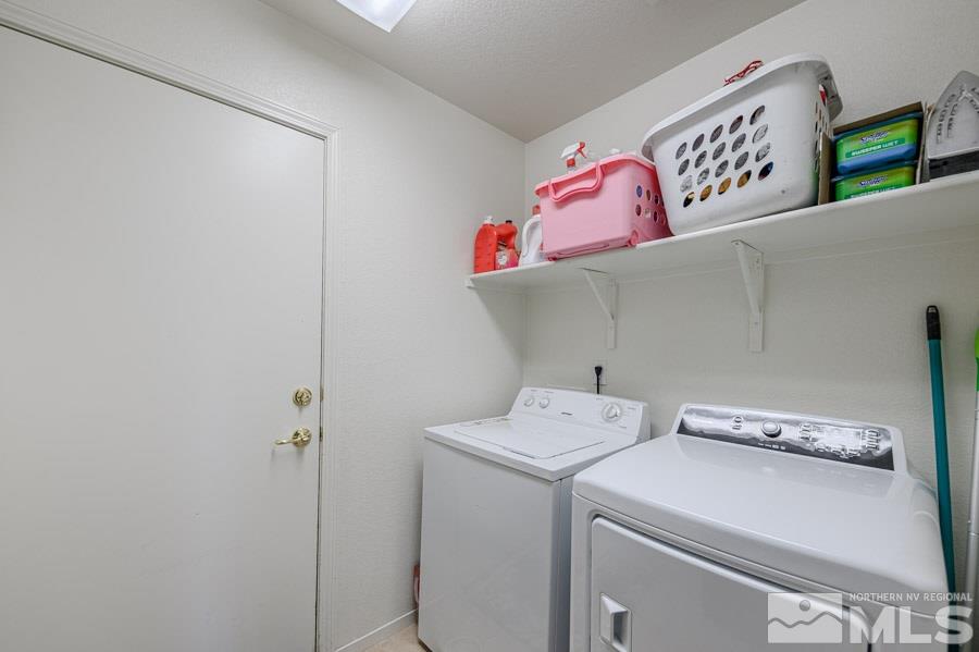 7635 Corso Street Reno, NV 89506 - Photo 16 of 19 a utility room with dryer and washer