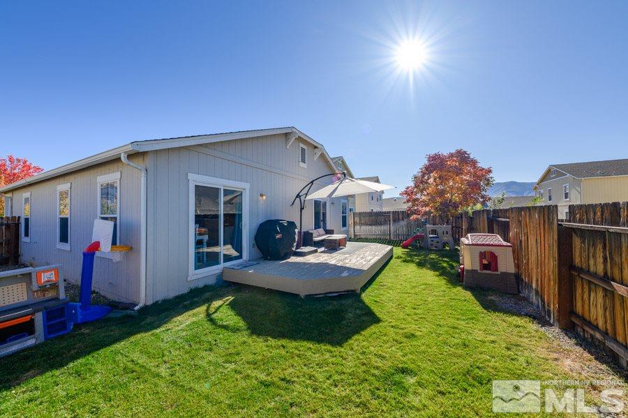 7635 Corso Street Reno, NV 89506 - Photo 17 of 19 a view of house with backyard porch and outdoor seating
