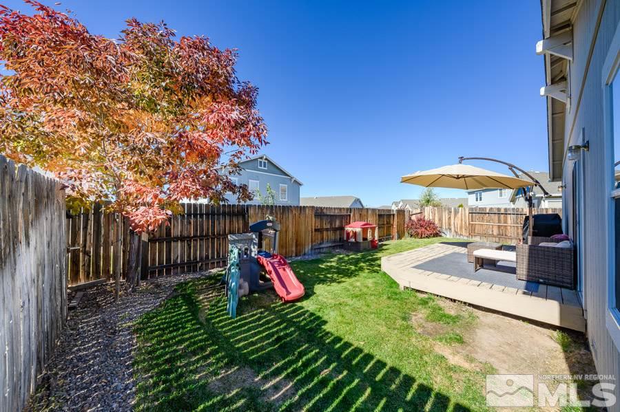 7635 Corso Street Reno, NV 89506 - Photo 18 of 19 a view of a backyard with a table and chairs
