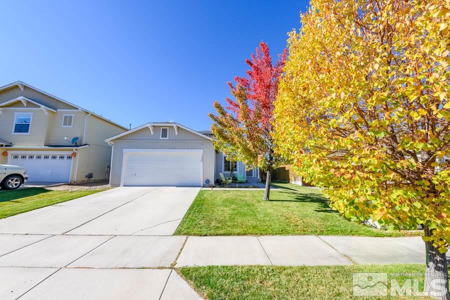 7635 Corso Street Reno, NV 89506 - Photo 2 of 19 a front view of a house with garden