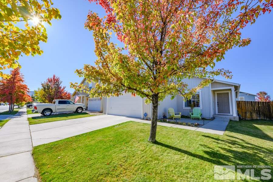 7635 Corso Street Reno, NV 89506 - Photo 3 of 19 a house with palm tree in front of it