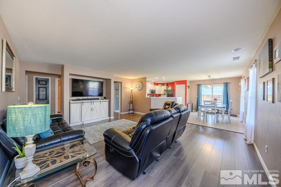 7635 Corso Street Reno, NV 89506 - Photo 4 of 19 a living room with furniture and a flat screen tv