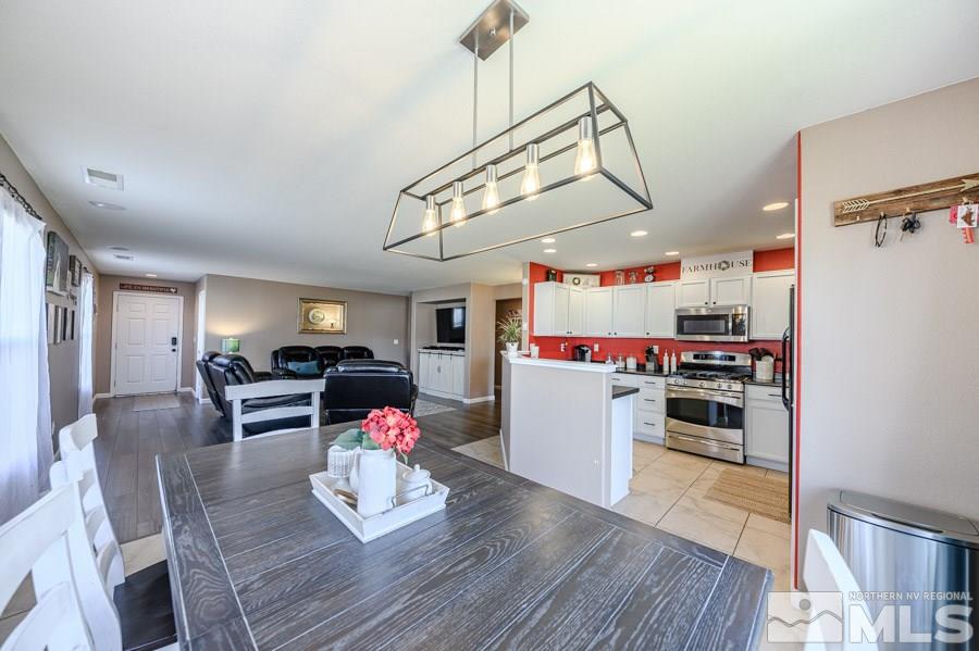 7635 Corso Street Reno, NV 89506 - Photo 6 of 19 a living room with furniture and kitchen view