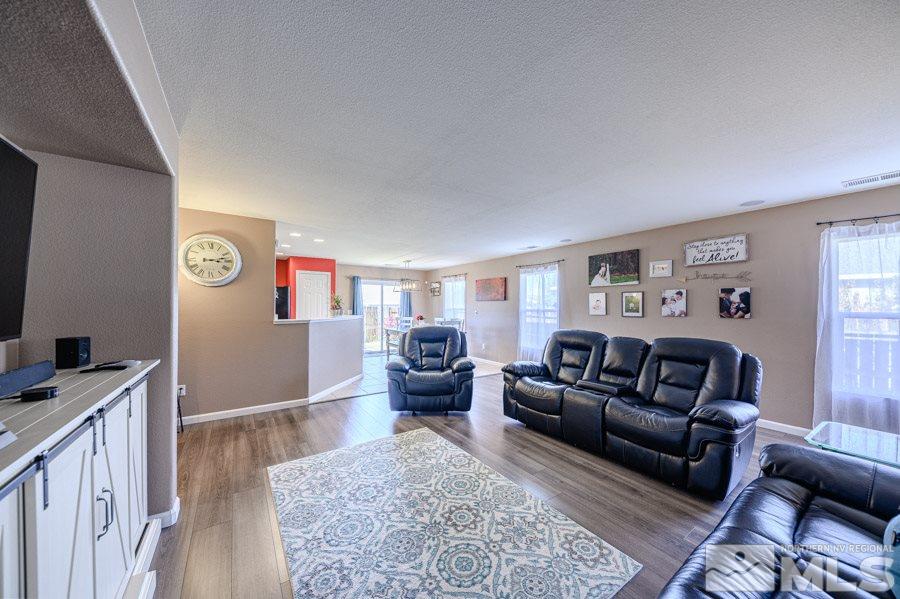7635 Corso Street Reno, NV 89506 - Photo 8 of 19 a living room with furniture and a flat screen tv
