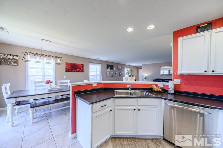 7635 Corso Street Reno, NV 89506 - Photo 10 of 19 a kitchen that has a sink and a stove in it