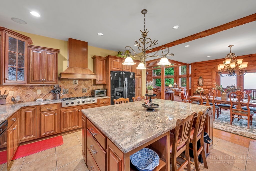 160 Outback Road Ferguson, NC 28624 - Photo 23 of 49 a kitchen with stainless steel appliances granite countertop counter space and a sink