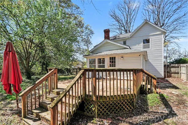 a front view of a house with a deck