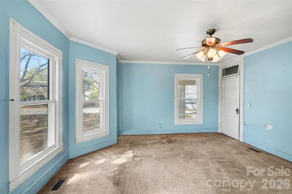 a view of an empty room with a window