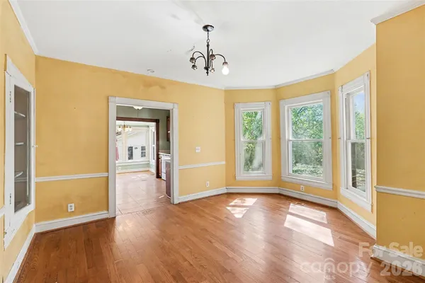a view of livingroom with hardwood floor and a ceiling fan