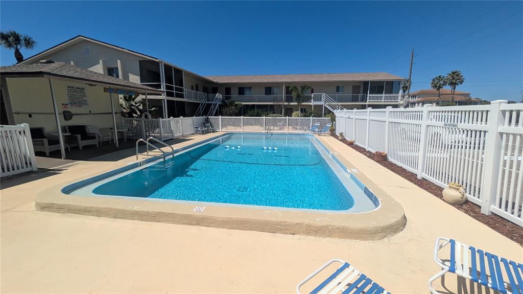 360 Base Avenue East, Unit 424 Venice, FL 34285 - Photo 13 of 20 a view of a swimming pool with a patio
