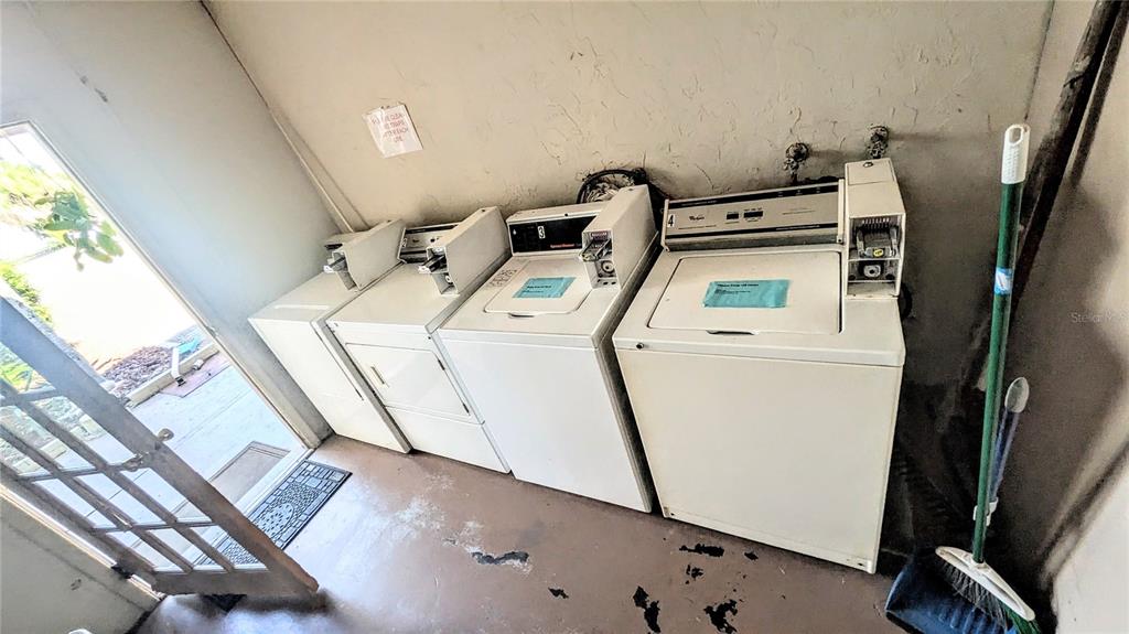 360 Base Avenue East, Unit 424 Venice, FL 34285 - Photo 14 of 20 a utility room with dryer and washer