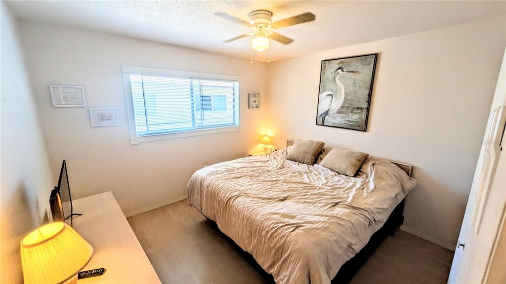 360 Base Avenue East, Unit 424 Venice, FL 34285 - Photo 7 of 20 a bedroom with bed and window