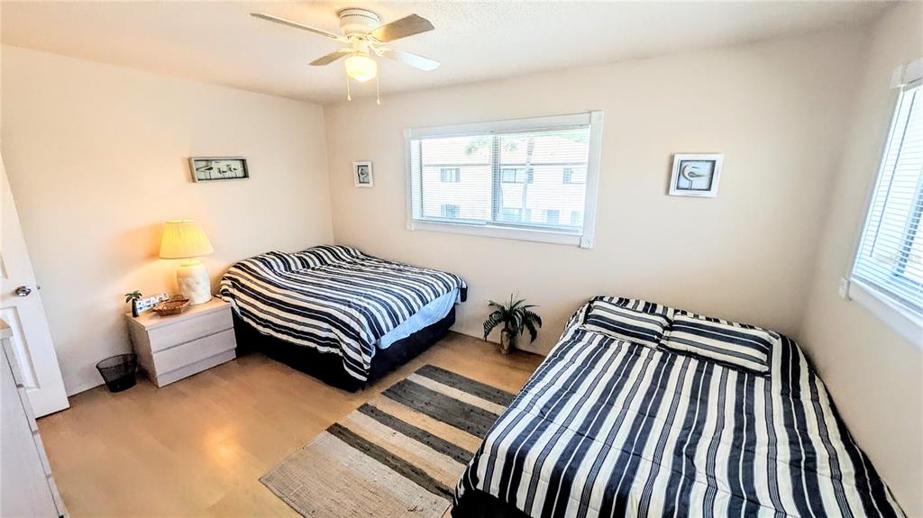 360 Base Avenue East, Unit 424 Venice, FL 34285 - Photo 10 of 20 a bedroom with a bed and a window