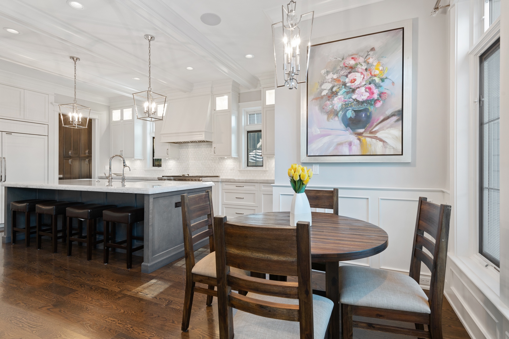 Undisclosed Address Wilmette, IL 60091 - Photo 18 of 66 a dining room with a table chairs and a kitchen view