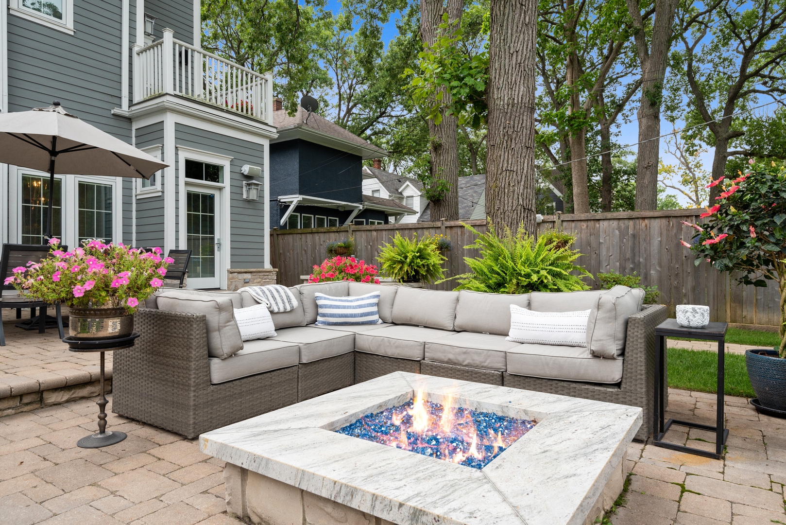 Undisclosed Address Wilmette, IL 60091 - Photo 56 of 66 a view of a patio with couches table and chairs and potted plants