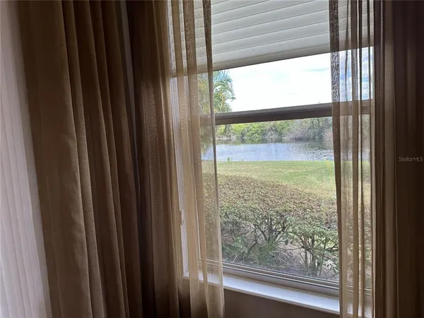 a view of a room that has a large window