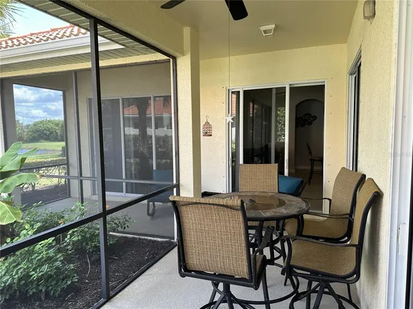 a dining room with furniture and front door