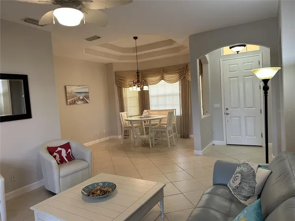 a living room with furniture and a table