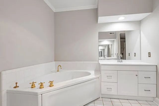 a bathroom with a bathtub and a sink