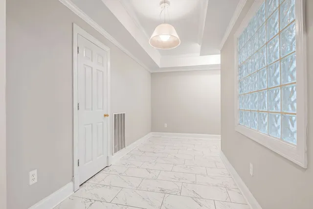 a view of an empty room and window