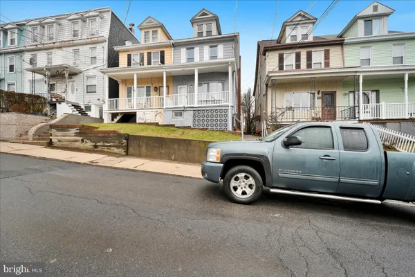 a front view of a house with parking space