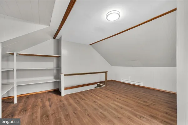 a bathroom with a sink mirror and toilet