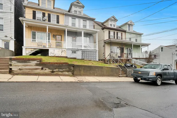a car parked in front of a house