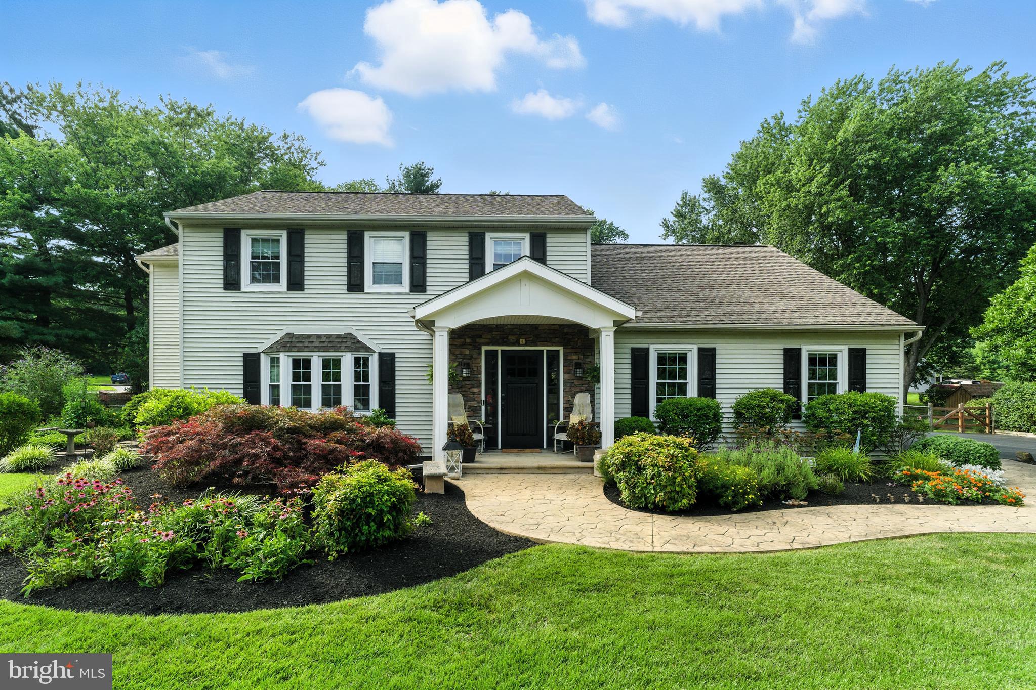4 Robin Road Exton, PA 19341 - Photo 2 of 45 a front view of a house with a garden