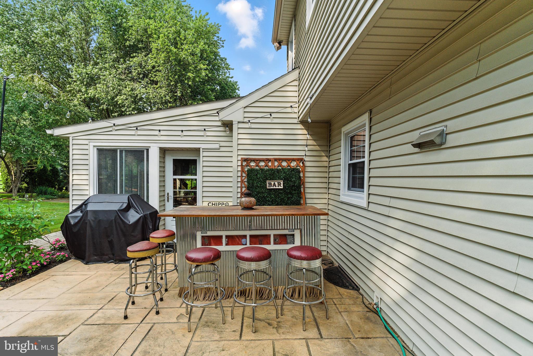4 Robin Road Exton, PA 19341 - Photo 22 of 45 a view of a chairs and table in the back yard of the house