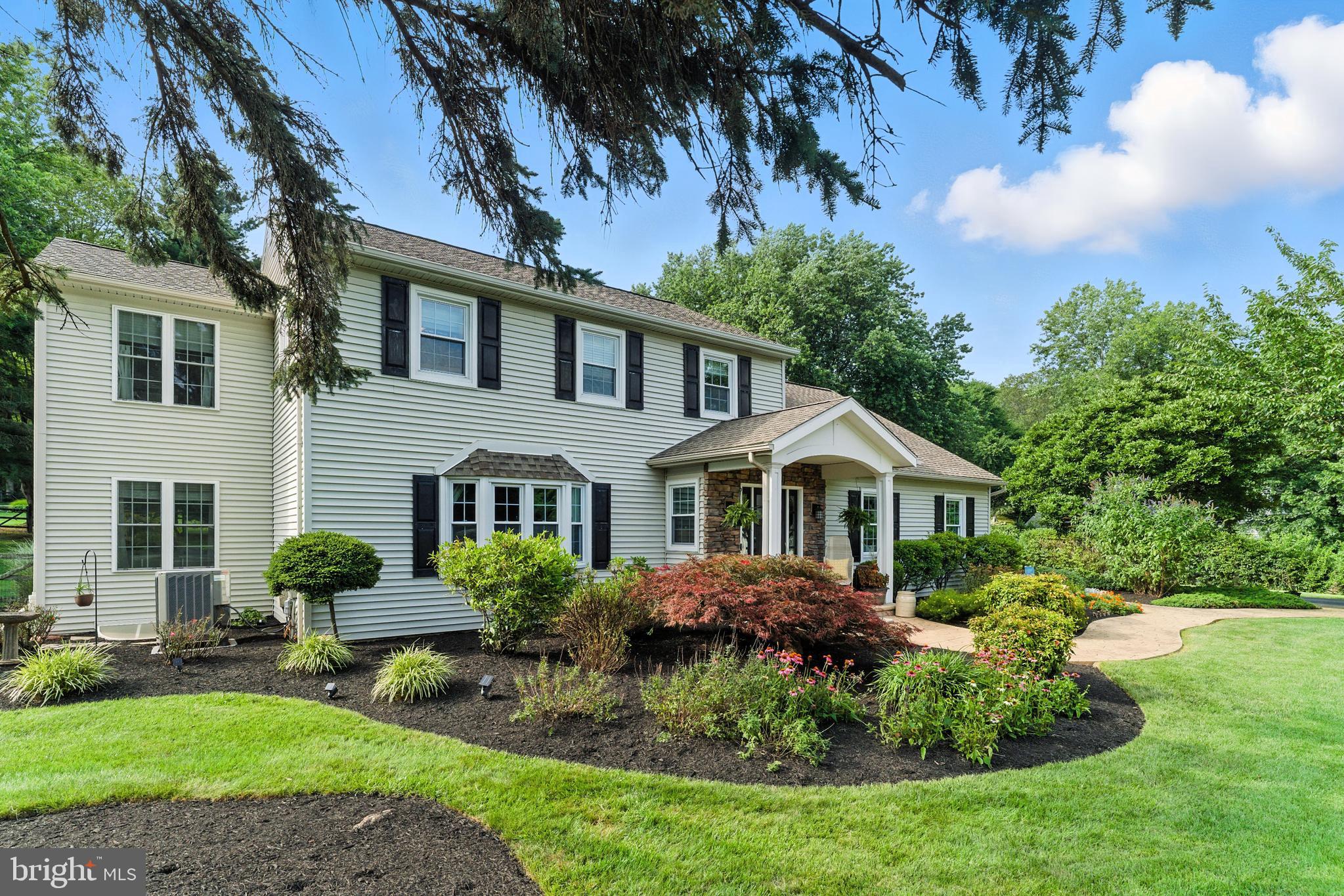 4 Robin Road Exton, PA 19341 - Photo 25 of 45 a front view of a house with garden