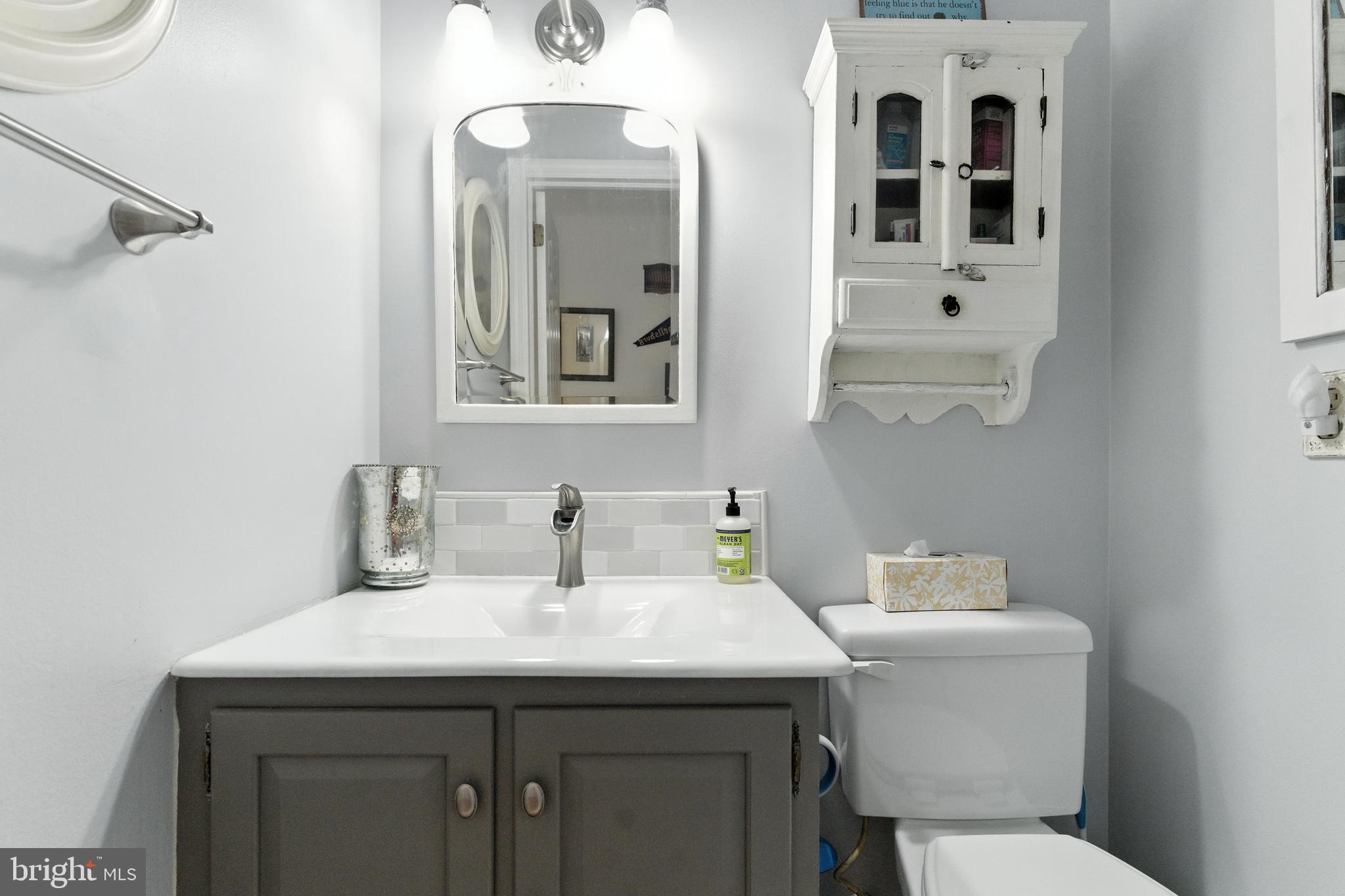 4 Robin Road Exton, PA 19341 - Photo 35 of 45 a bathroom with a toilet sink and mirror