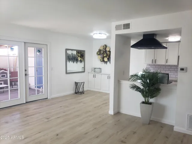 a view of livingroom with furniture and a potted plant