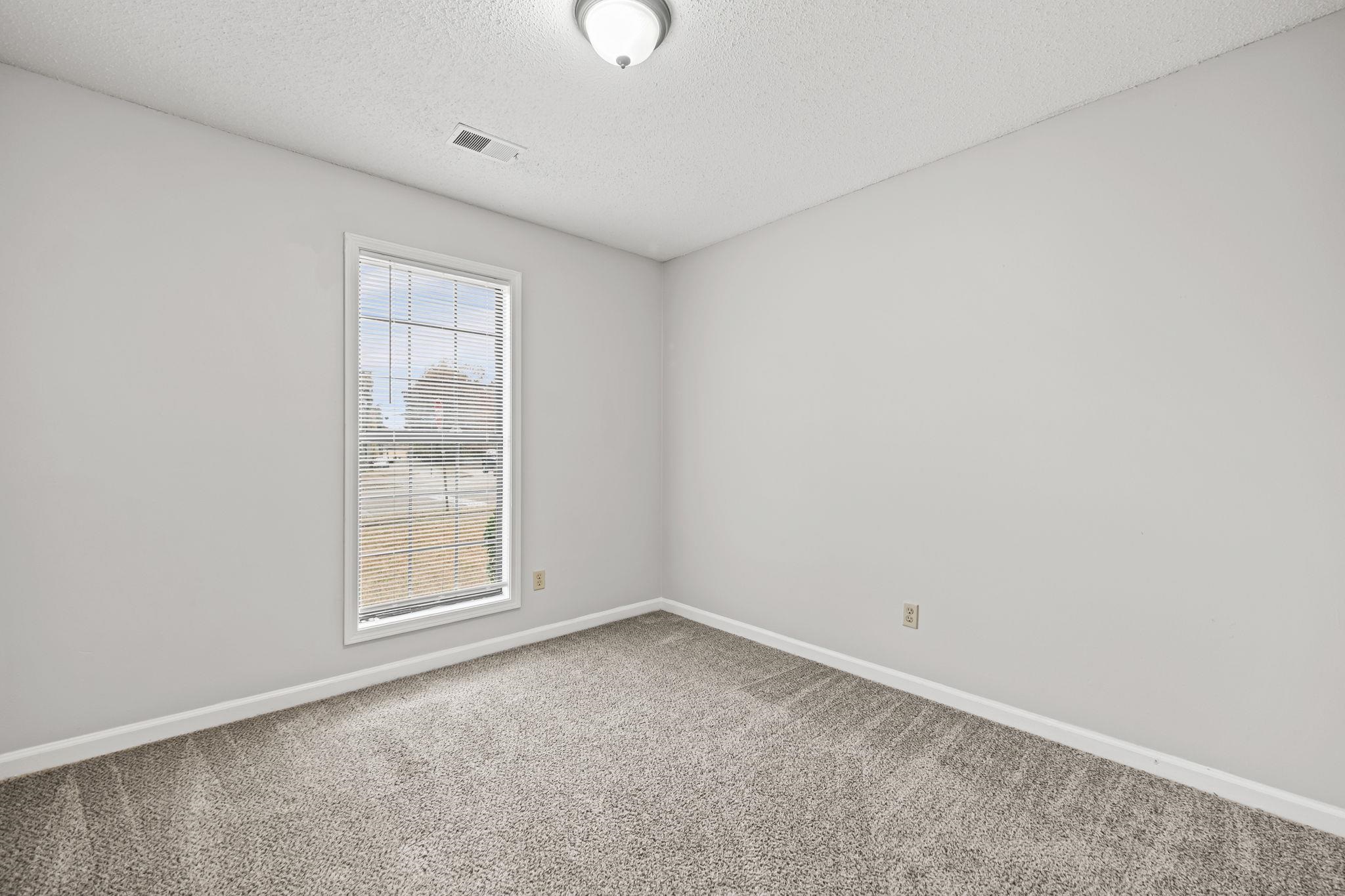6730 Birch Run Lane Memphis, TN 38115 - Photo 11 of 20 an empty room with windows