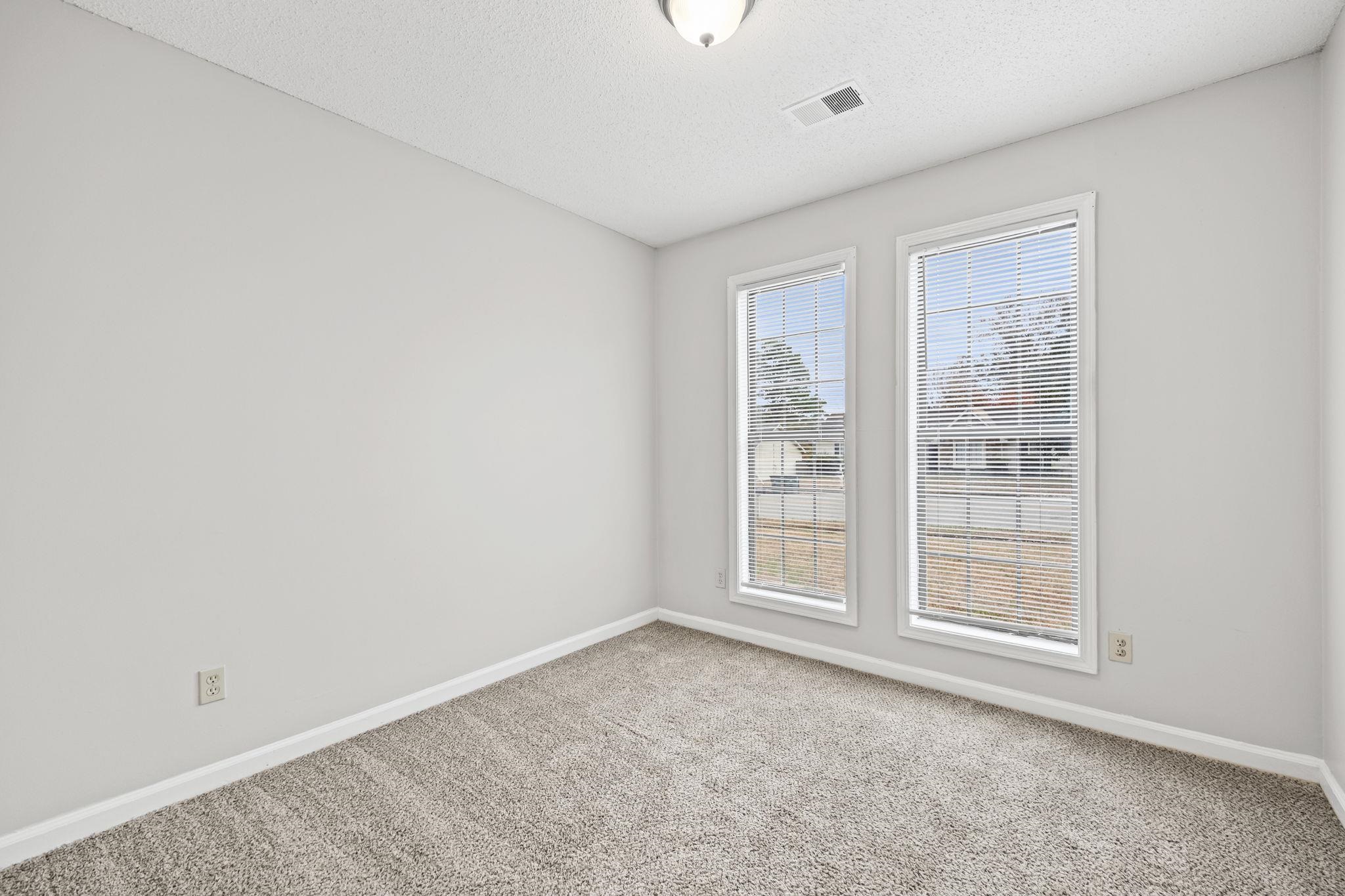 6730 Birch Run Lane Memphis, TN 38115 - Photo 12 of 20 a view of an empty room with a window