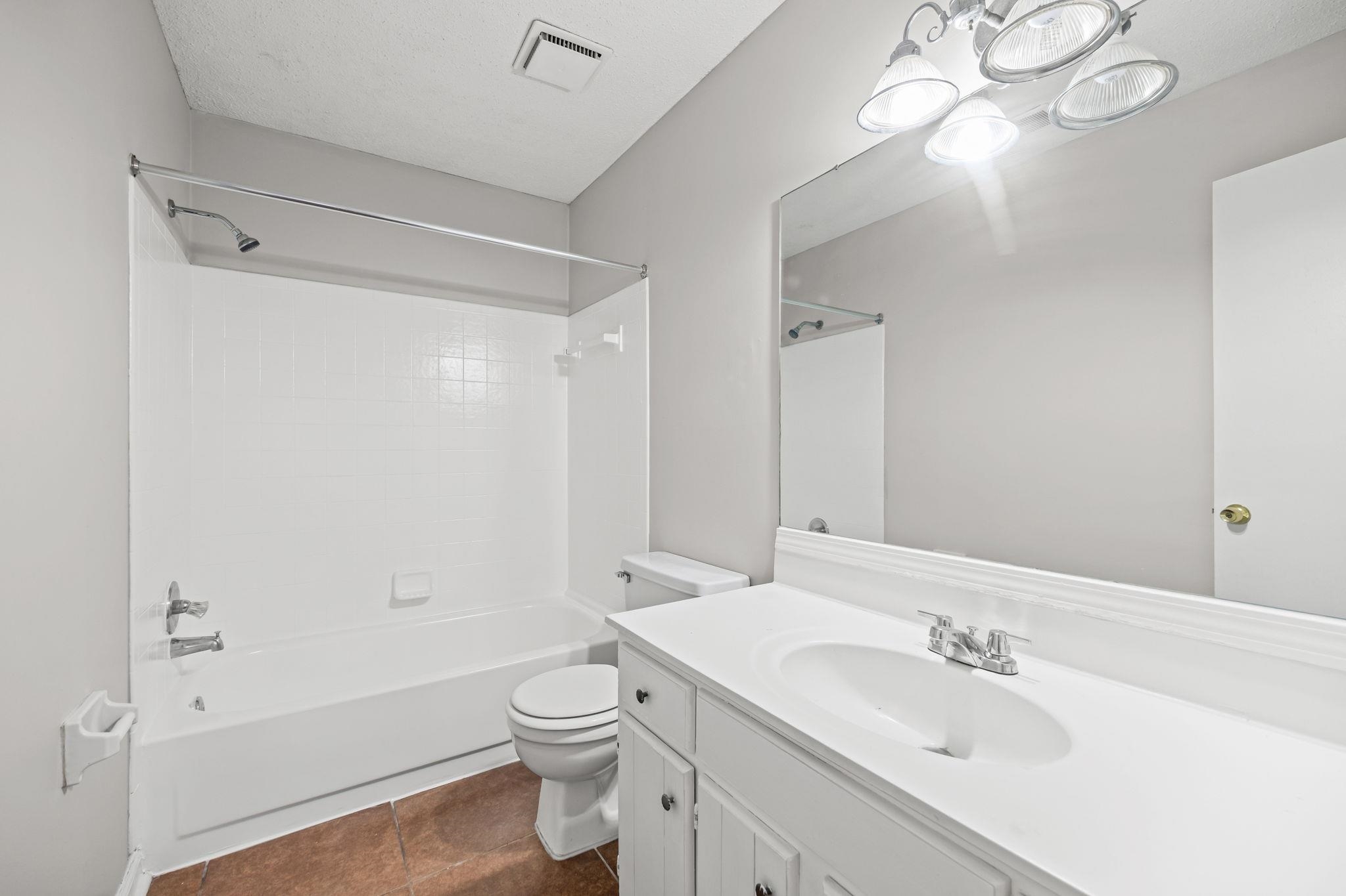 6730 Birch Run Lane Memphis, TN 38115 - Photo 13 of 20 a bathroom with a sink toilet tub and shower