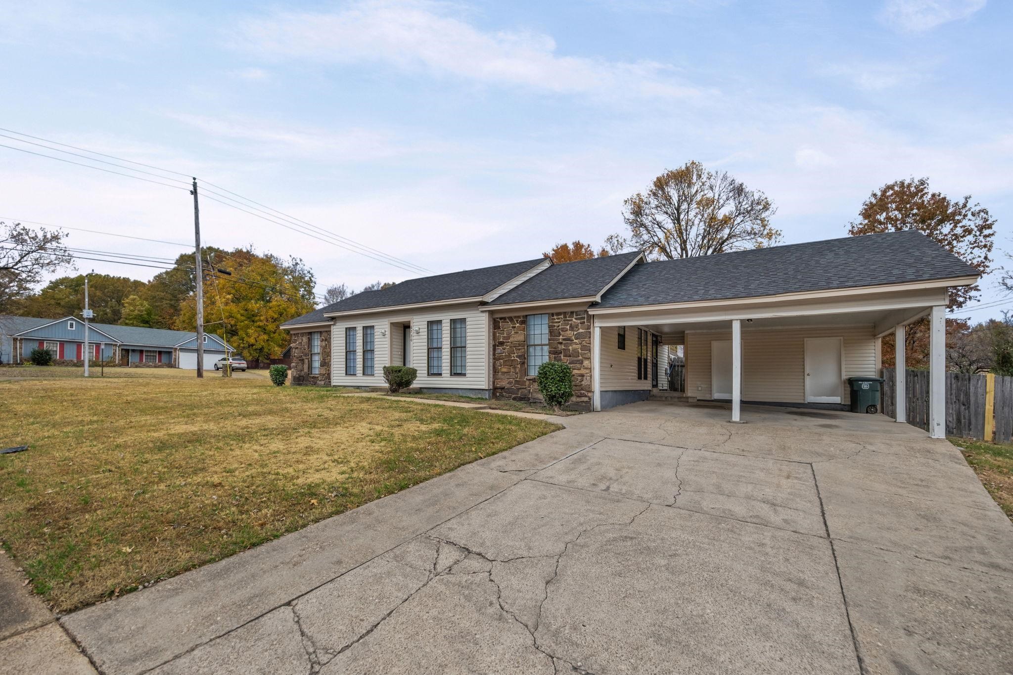6730 Birch Run Lane Memphis, TN 38115 - Photo 2 of 20 a front view of a house with a garden