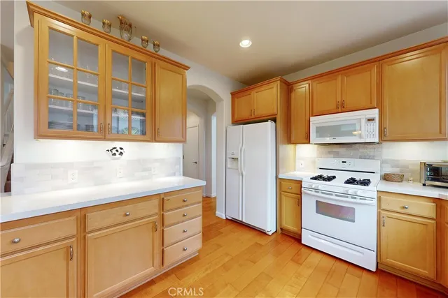 a kitchen with a sink stove and microwave