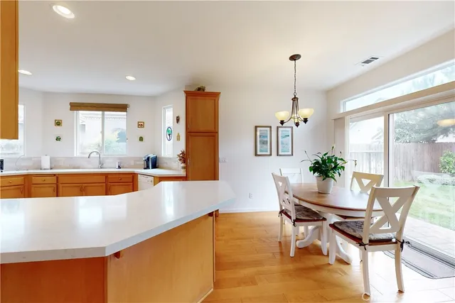 a view of a dining room with furniture window and outside view
