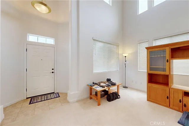 a living room with furniture a rug and a flat screen tv