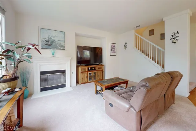 a room with furniture and a fireplace