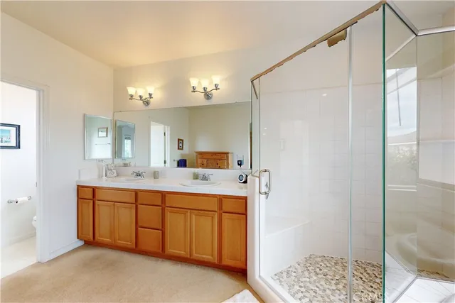 a view of a closet area with wooden floor