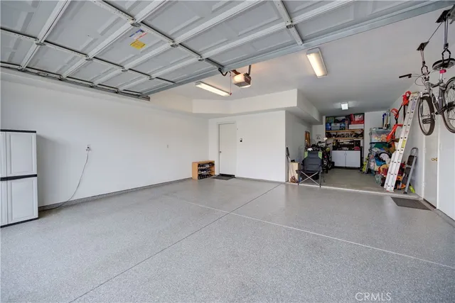 a view of a garage with rack and bicycle