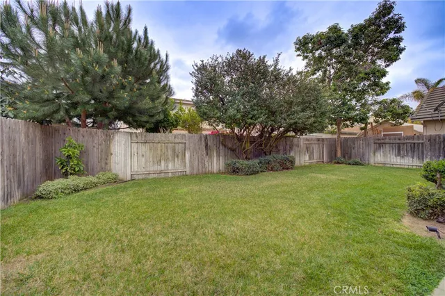 a large kitchen with stainless steel appliances granite countertop a stove and a sink