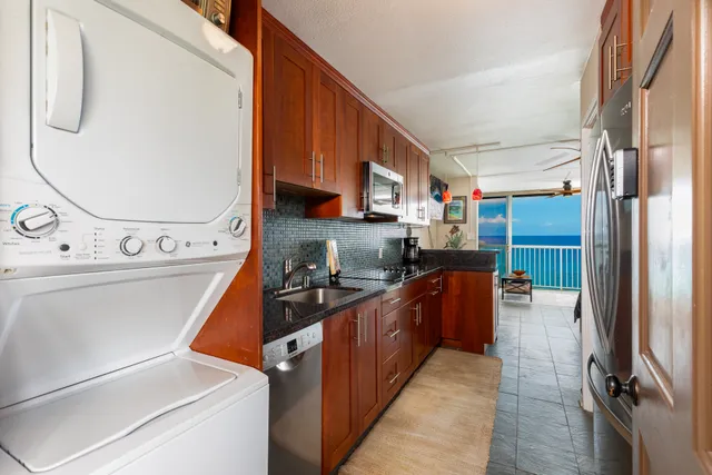a kitchen with a refrigerator and a stove