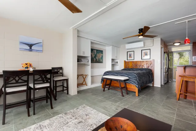 a bedroom with furniture and a chair