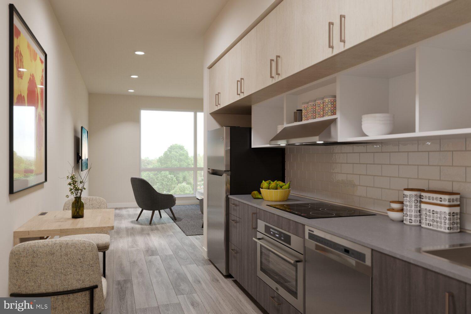 1314 Spring Garden Street, Unit 302 Philadelphia, PA 19123 - Photo 3 of 26 a kitchen with a sink cabinets and window