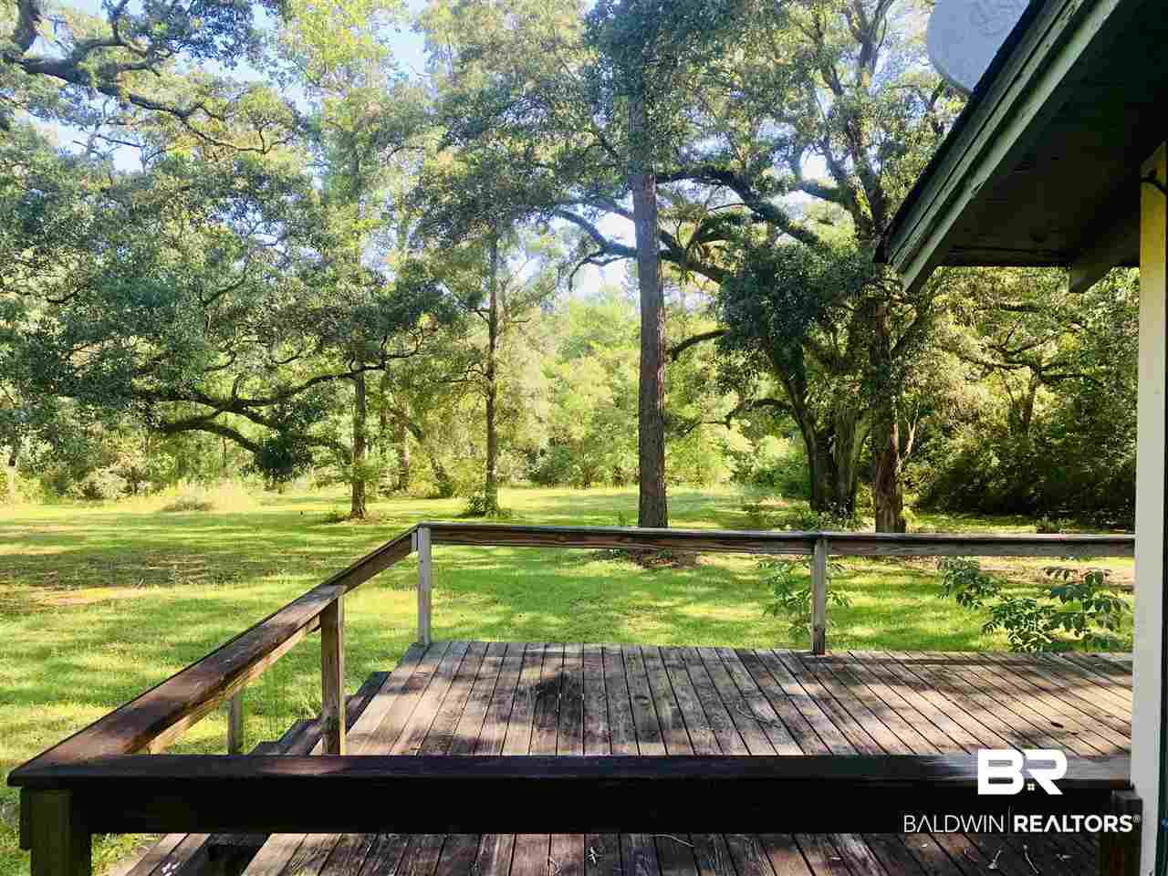 17071 County Road 52 Silverhill, AL 36576 - Photo 10 of 44 Deck overlooking the creek from bedroom 2