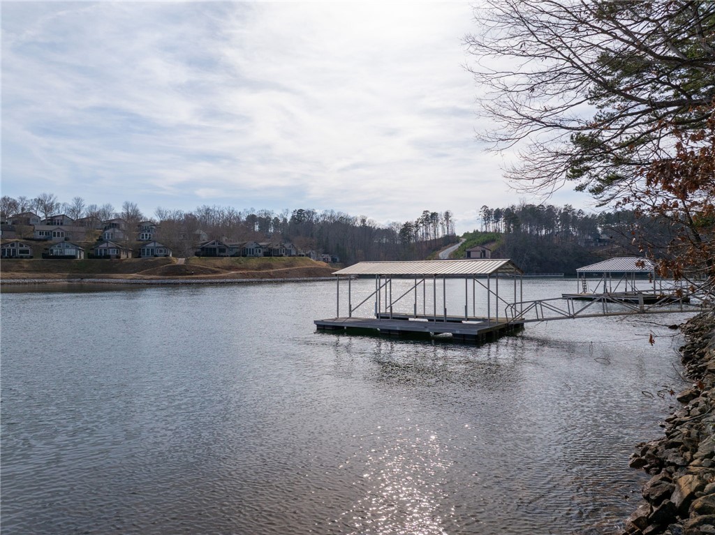 537 Peninsula Road West Union, SC 29696 - Photo 11 of 15 This serene waterfront property features a private dock, offering direct access to the expansive lake.