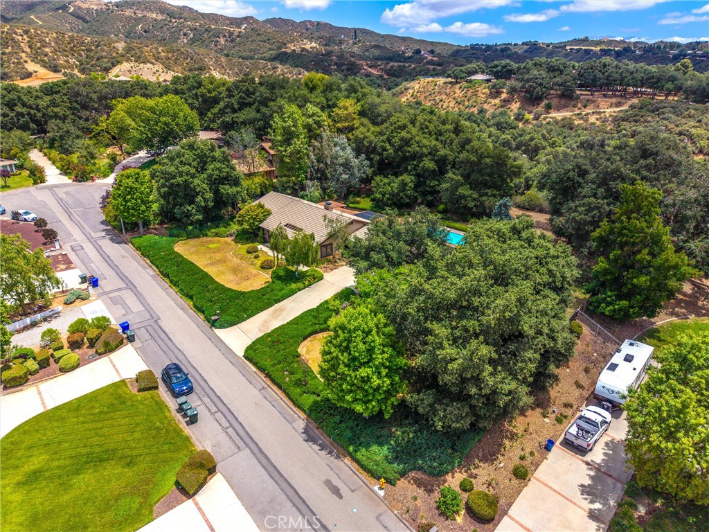 37295 Oak View Road Yucaipa, CA 92399 - Photo 53 of 59 an aerial view of green landscape with trees houses and mountain view