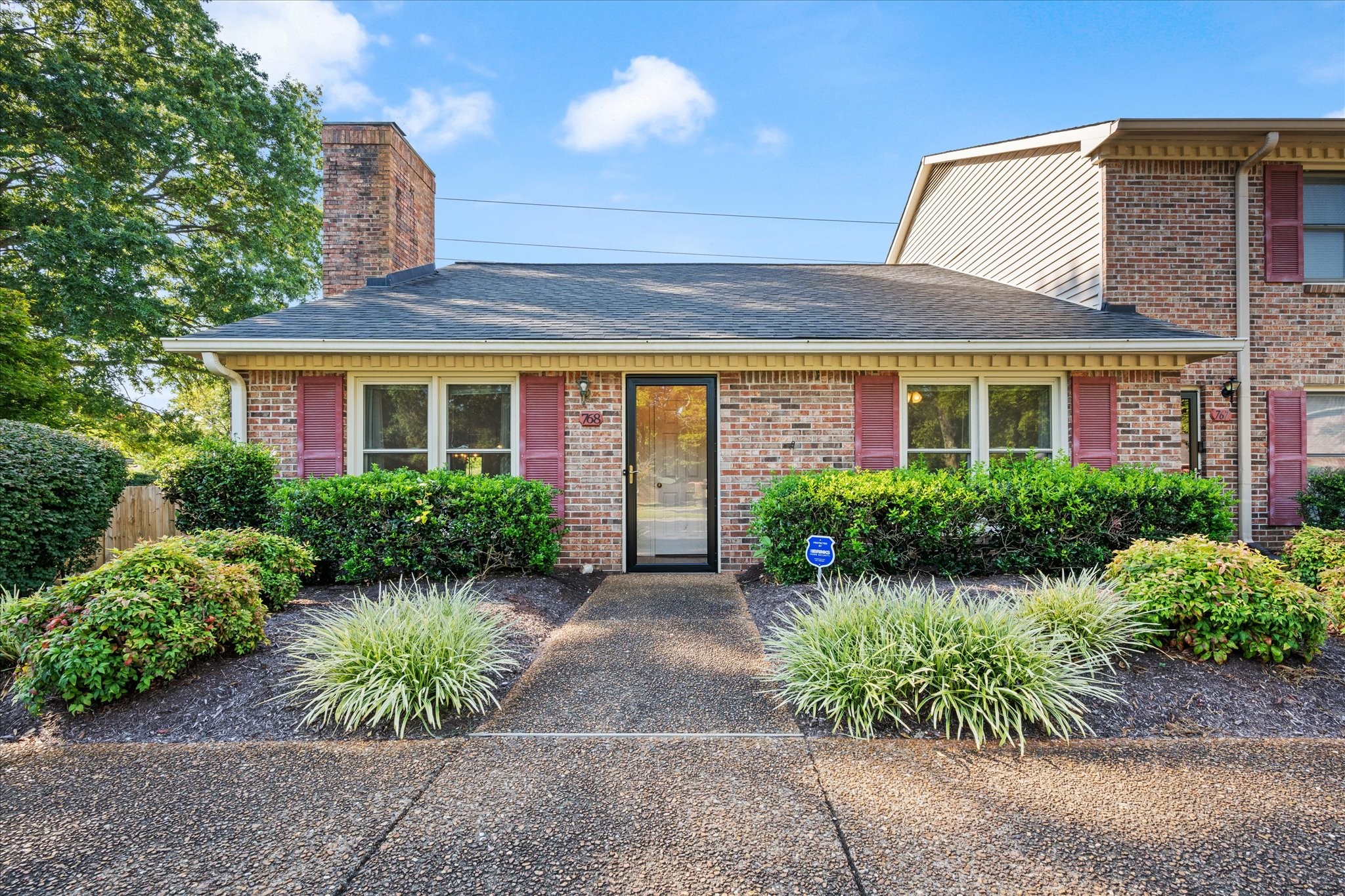 768 Kent Road Nashville, TN 37214 - Photo 1 of 20 a view of a house with potted plants and a large tree